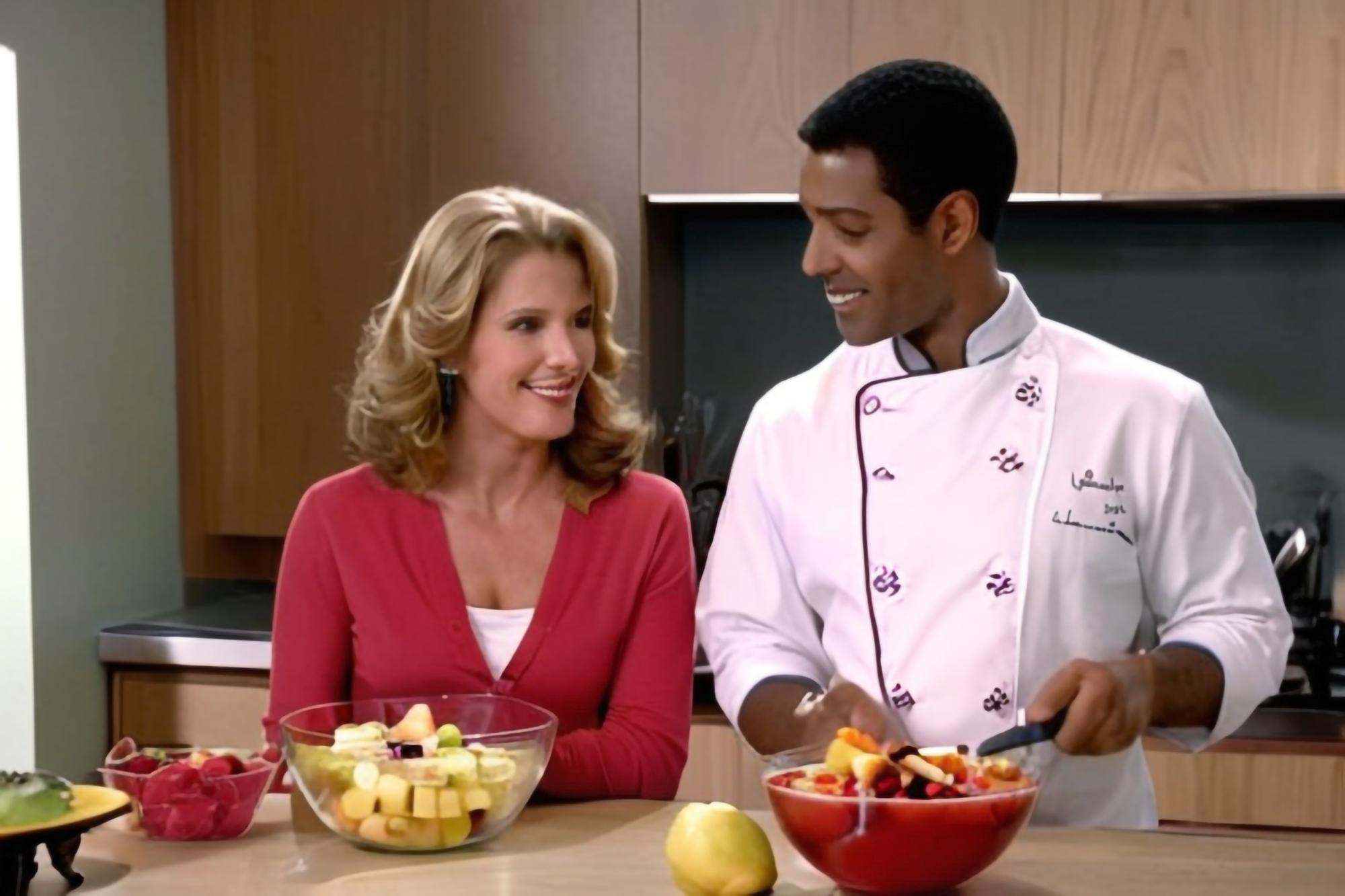 Chef consulting with client over a plated dish