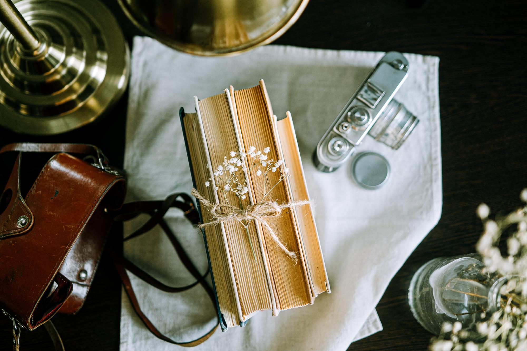 Stacked recipe books with brass bookmark